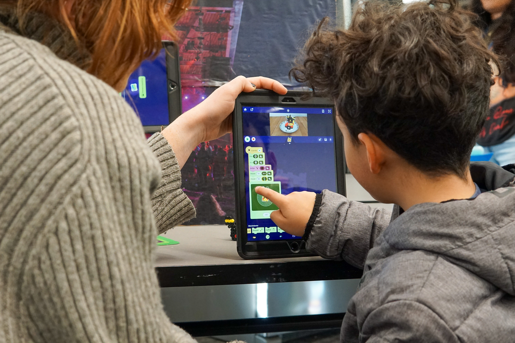 An image on a young individual using a tablet with Octostudio